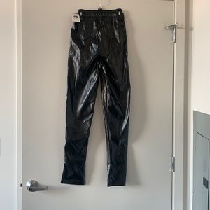 Black leather pants with split